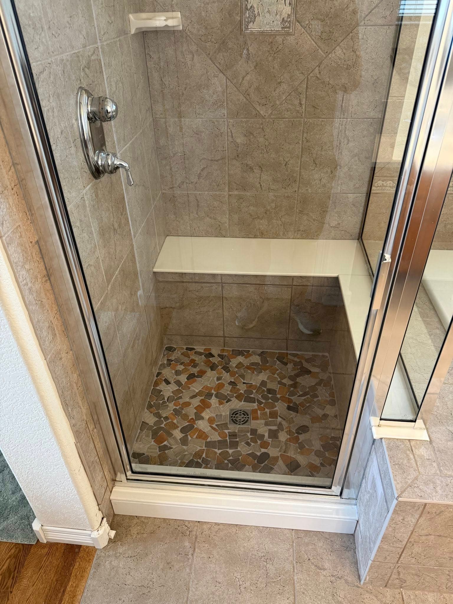 Custom shower stall with mosaic stone pan
