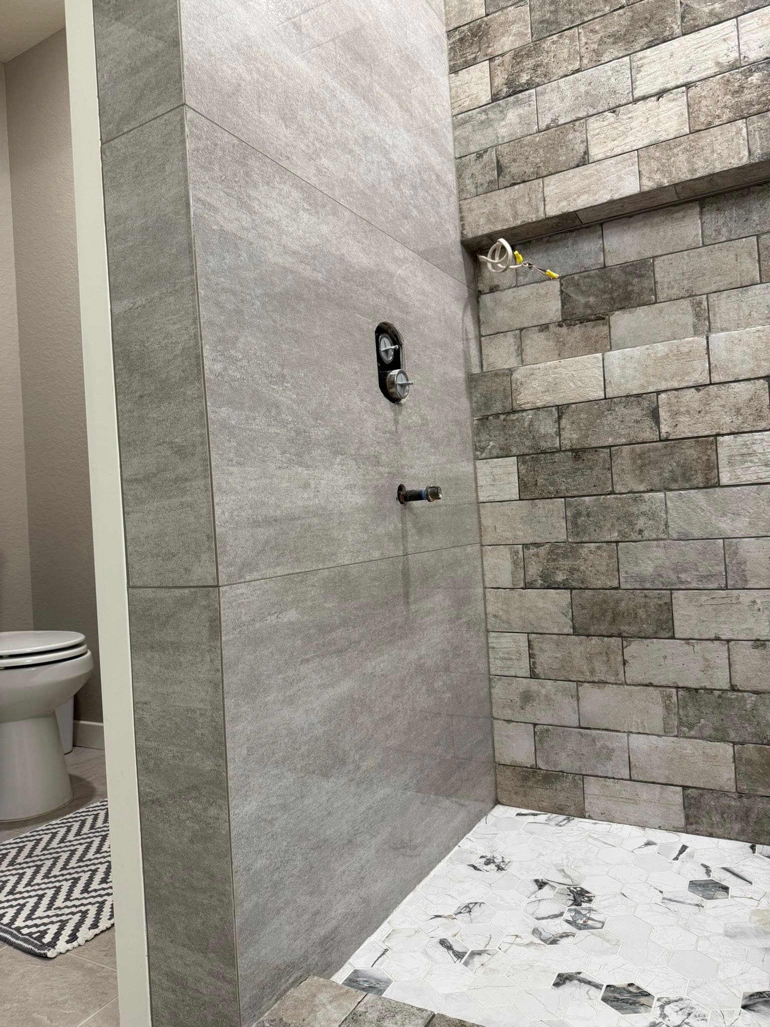 Custom tile installation in residential bathroom