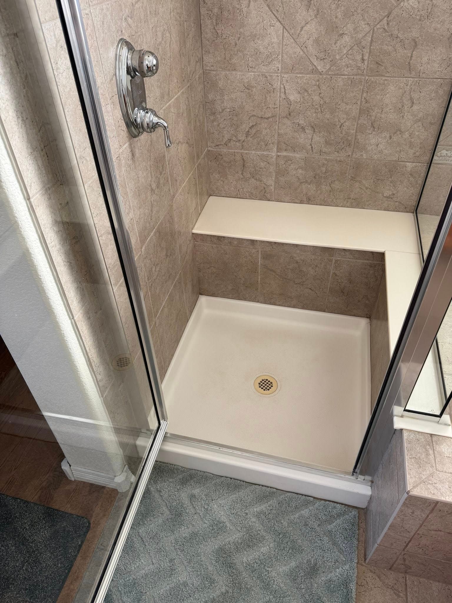 Travertine shower with built-in seat