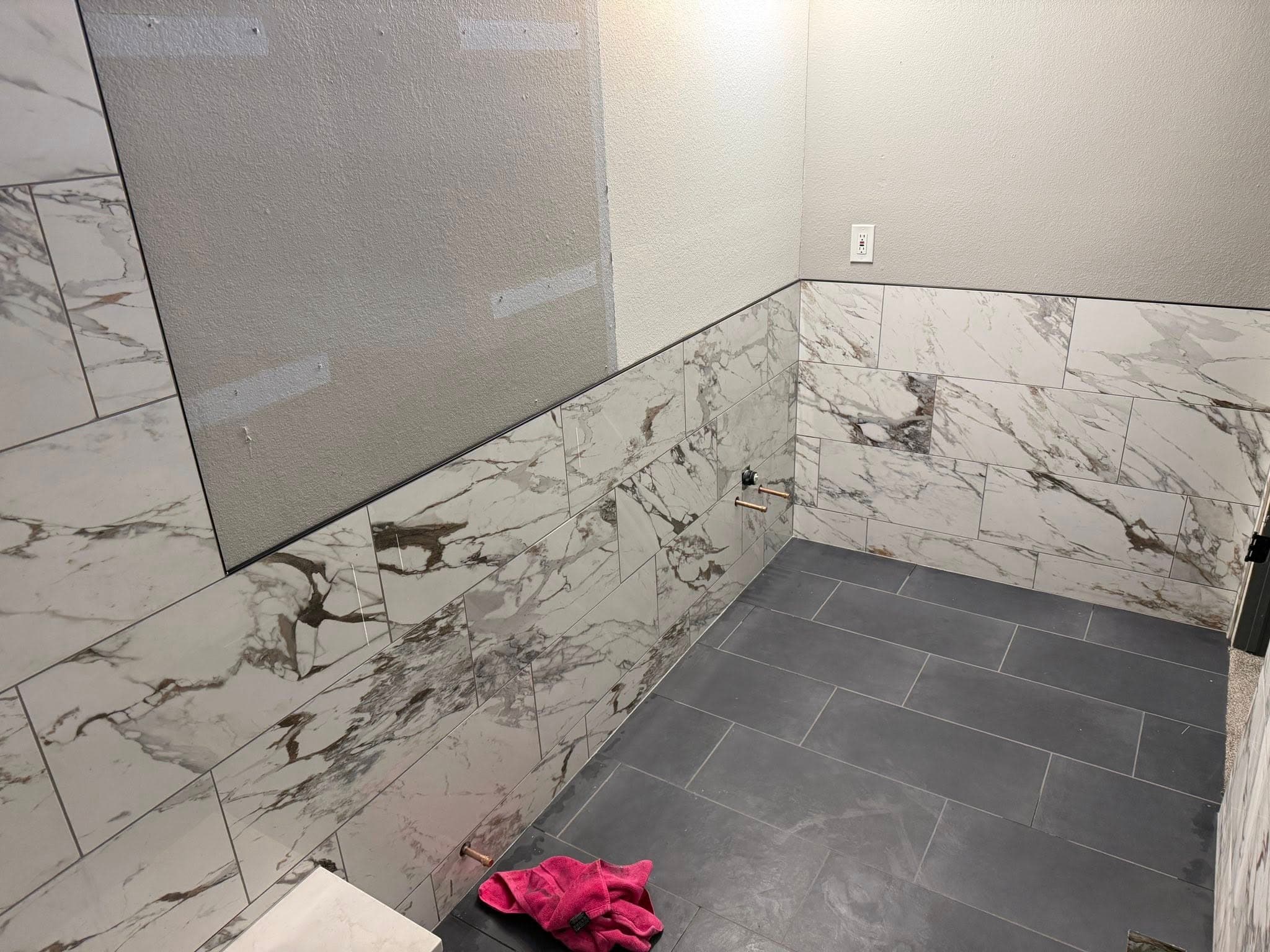 Calacatta marble bathroom walls with charcoal floor